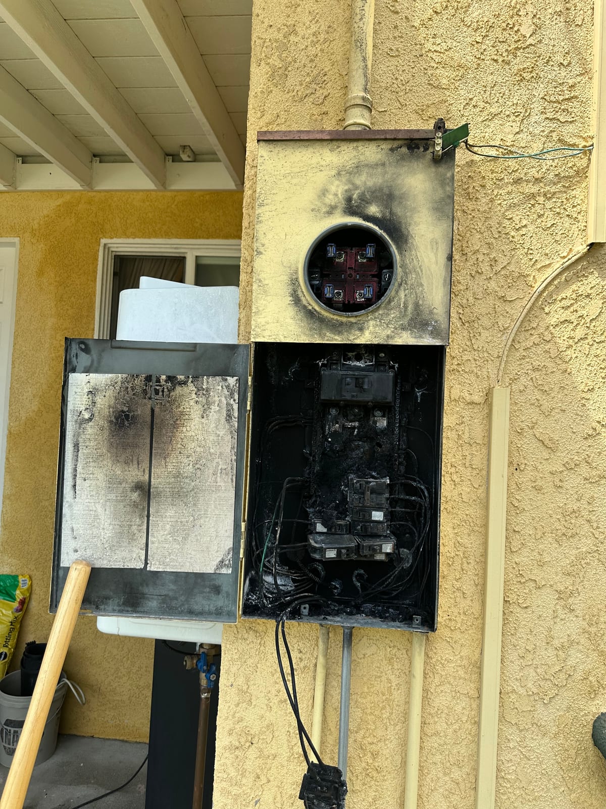 Electrical fire damage to panel